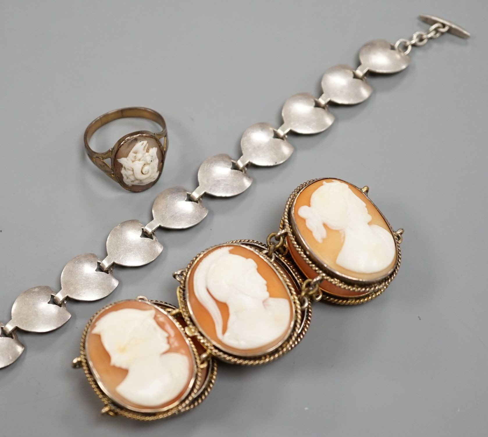A gilt white metal and cameo shell set bracelet, a similar ring and a sterling 925 bracelet.